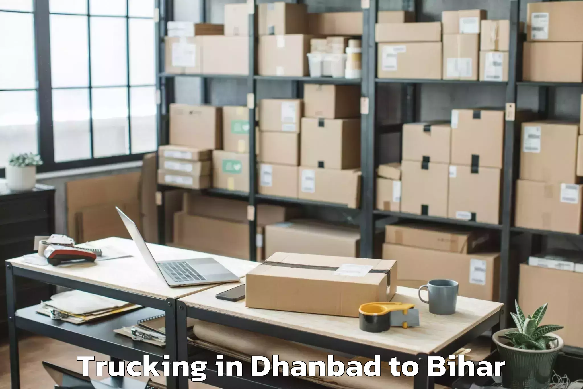 Trusted Dhanbad to Barauli Trucking